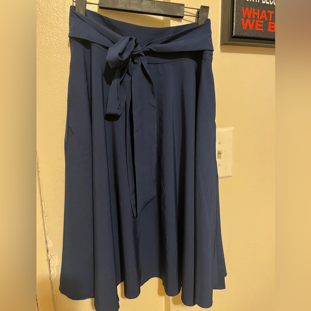 women’s blue maxi skirt. zipper in the back. bow-tie in the front
